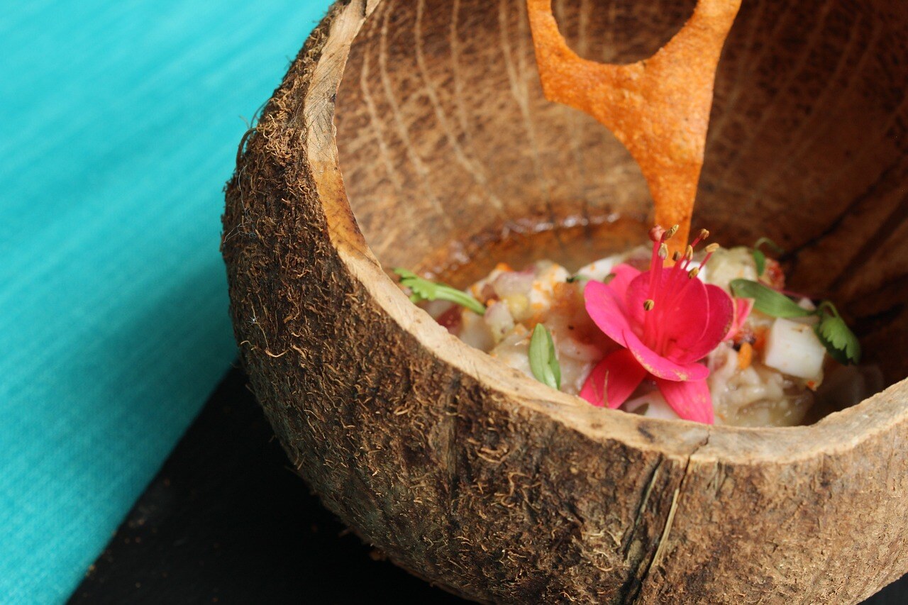 Fresh seafood prepared with coconut and served in a coconut shell